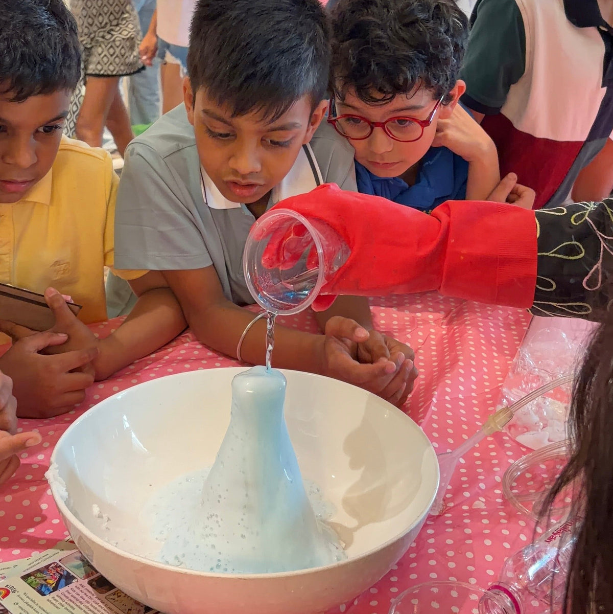 children looking at a science experiment